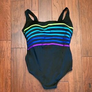 Inches Away swimsuit with vibrant rainbow stripes on a sleek black suit Size 24W